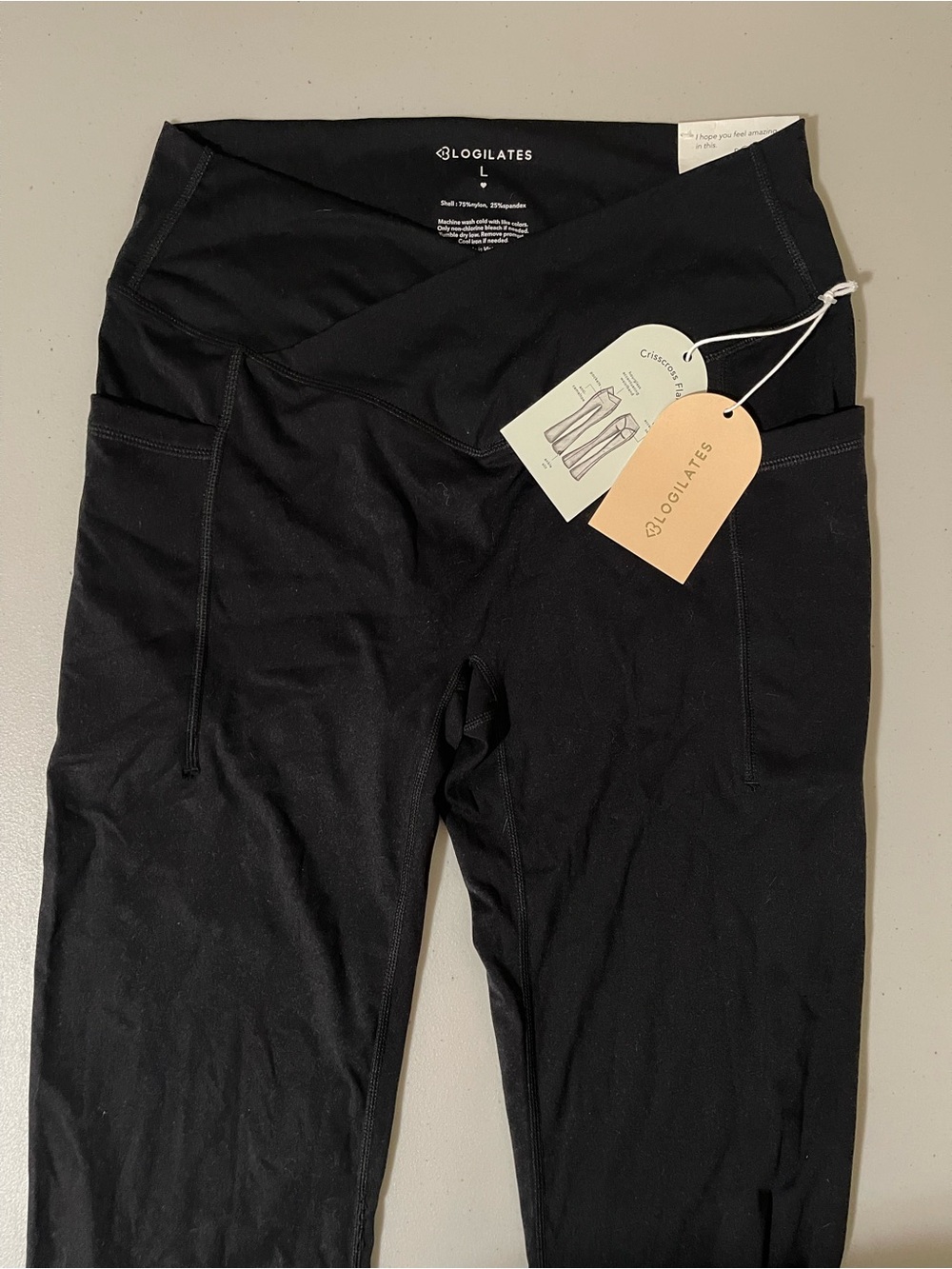 Blogilates Crisscross waist pocket flare leggings size L